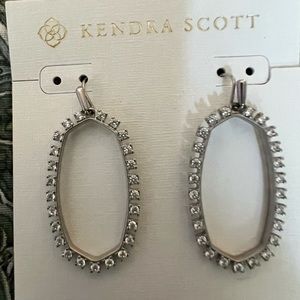 Kendra Scott rhinestone oval earrings.